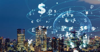 Currency symbols are seen floating above a nocturnal city skyline, seeming to orbit around the illuminated outline of a globe which occupies the right half of the frame