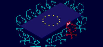 Against a deep navy background, a rectangular table adopting the form and colours of the EU flag is seen at an angle, from above, with a series of turquoise ooutlines of office chair surrounding it, all of which face inwards, while one identically shaped outline in red faces away from the table, with the British Union Jack flag emblazoned on its back.