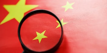 China flag with a magnifying glass