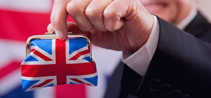 man holding wallet with british flag