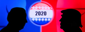 The two-dimensional silhouettes of Donald Trump and Joe Biden are seen facing each other, in profile view, with a background centrepieced by a large presidential campaign badge displaying the figure 2020, adorned with white stars and exhibiting red, blue and white striping, all of which appears against a backdrop split down the middle by panes in two solid blocks of blue and red.